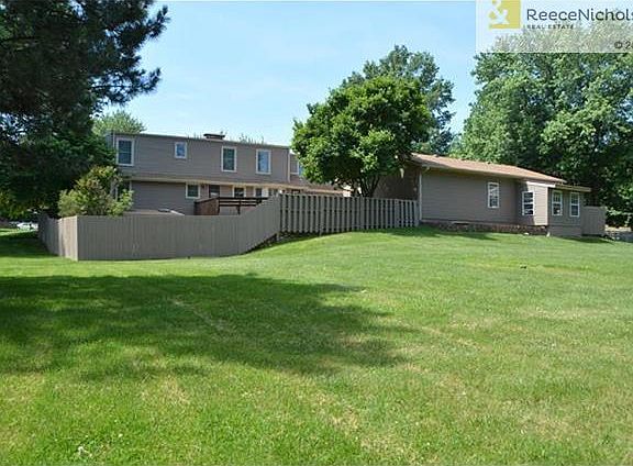 1.3 acres, partly fenced, treed lot, sprawling lawn