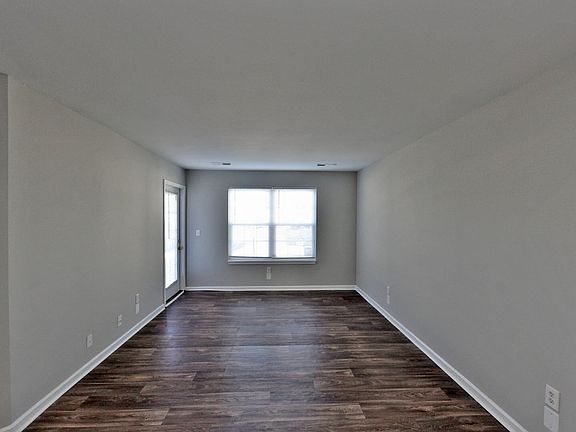Spacious living room with hardwood-style flooring