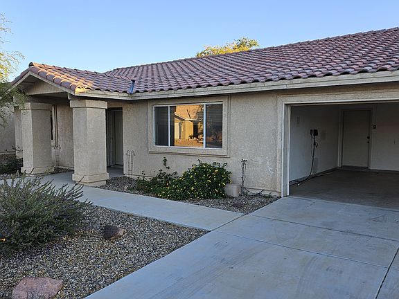 Front yard and two-car garage