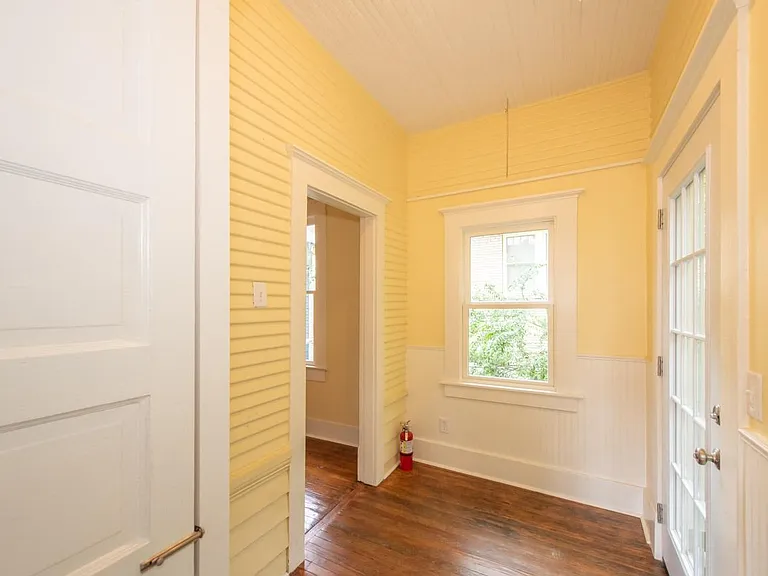 Former rear porch, now enclosed laundry area.