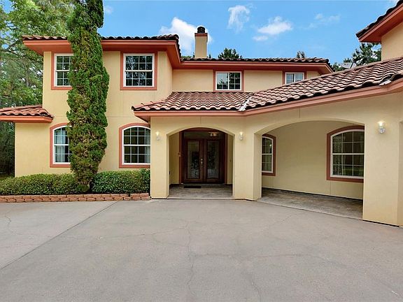 The French glass doors are an elegant touch to this remarkable Mediterranean style Home