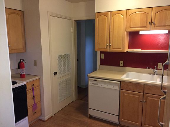 Kitchen, another cabinet beside wall and adjacent open wall not shown
