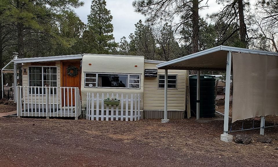 Front of house with carport