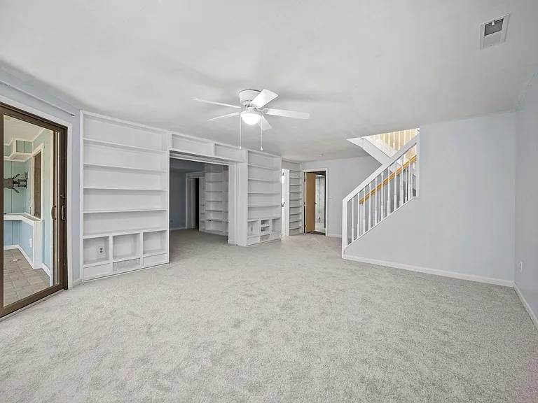 Lower level living area with walk out to screened-in-porch