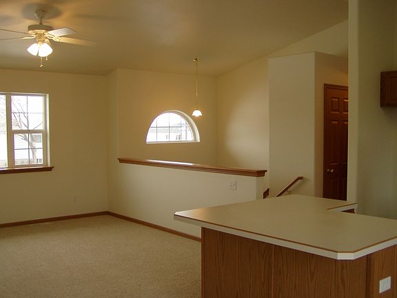 Looking from dining room to entry area and living room