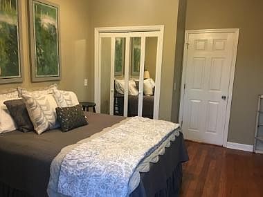 CURRENTLY UNFURNISHED...but Downstairs bedroom holds a Queen Bed. Huge walk-in closet in BOTH bedrooms.