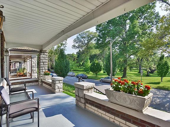 Spacious front porch w/ park views