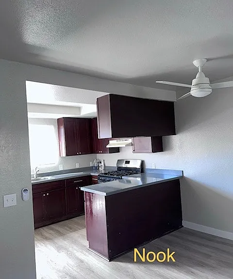 "Open kitchen featuring center island and dining nook."