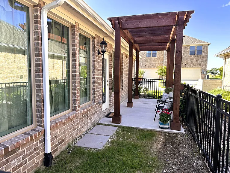 Perfect outdoor oasis with pergola and fenced in yard