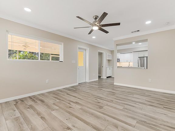 Livingroom with recessed lighting and ceiling fan