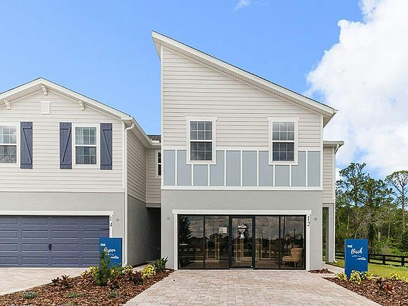 This spacious two-story, end-unit townhome includes a 2-car garage and paver driveway.