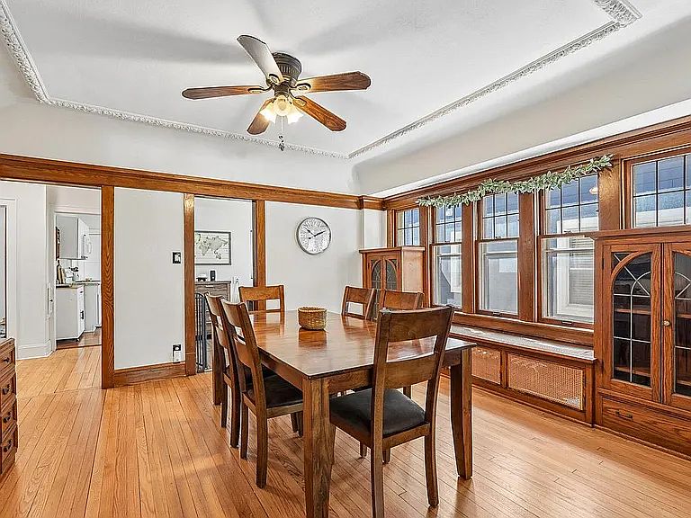 Spacious dining room with built-ins and ample south facing windows.