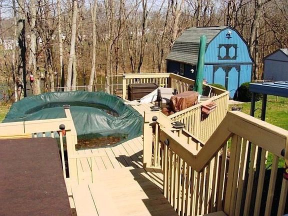 Private pool with wrap-around deck, plus 2-story shed.