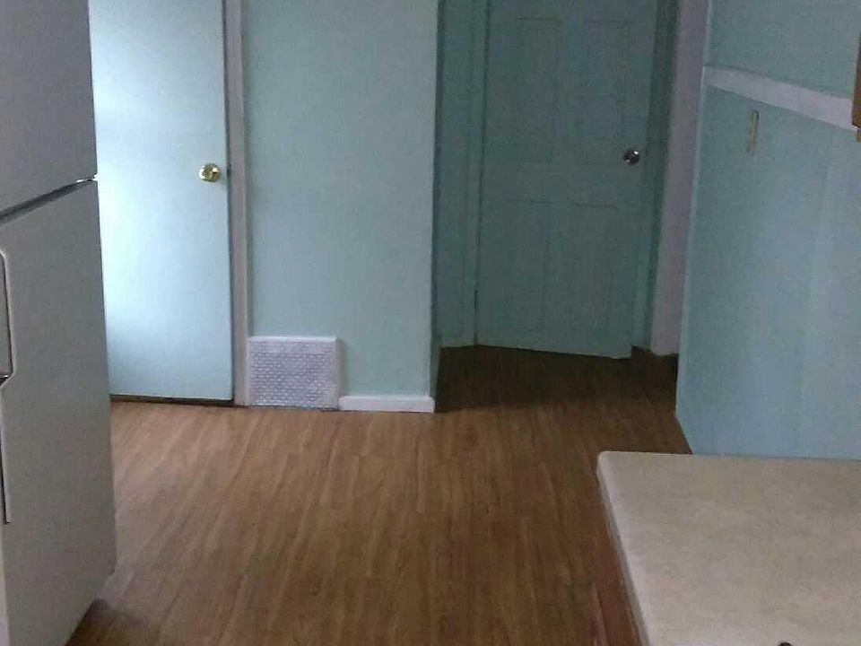 Kitchen- door to bathroom and the other backdoor