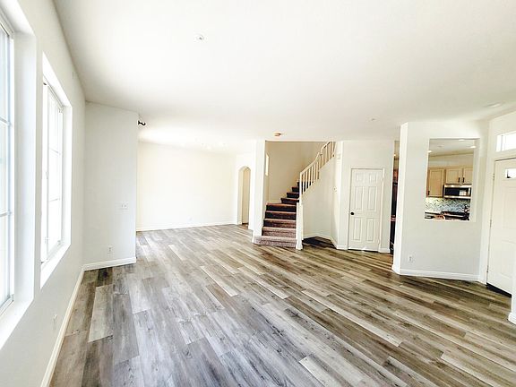 Brand new vinyl flooring, new carpeted stairs, newly painted with grey dual layer roller shades