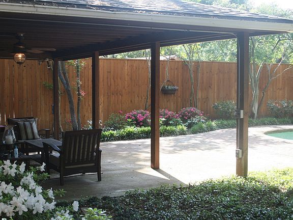 Outdoor area with cabana, large family pool, and generous yard for playset