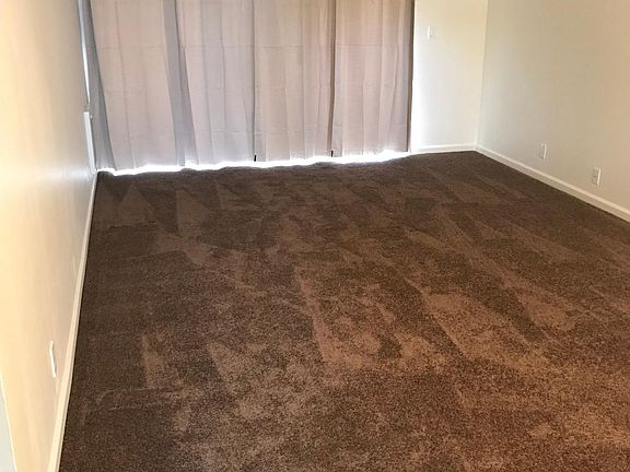 Roomy living / dining room combo. New carpeting.