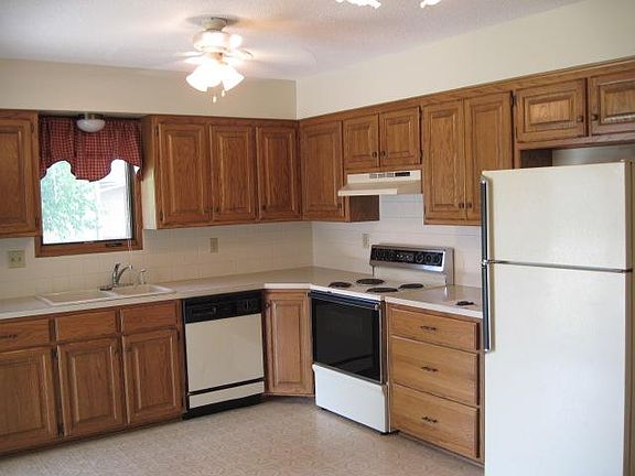 Kitchen includes refrigerator, oven/stove, and dishwasher