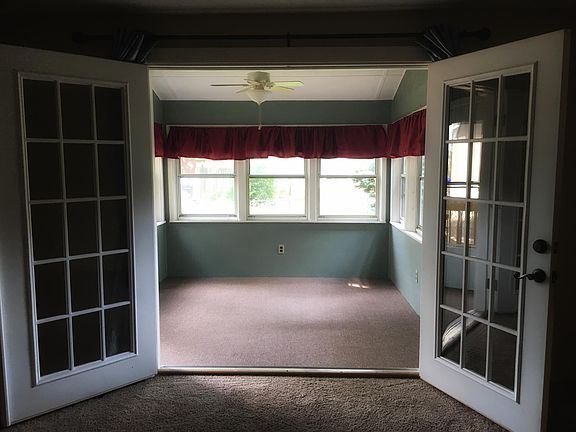 French doors leading to sunroom/back deck