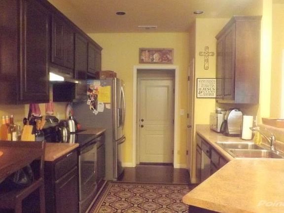 Kitchen with stainless appliances, Fridge remains