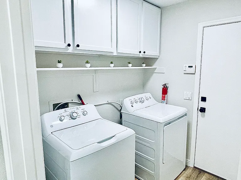 Laundry room stocked with supplies
