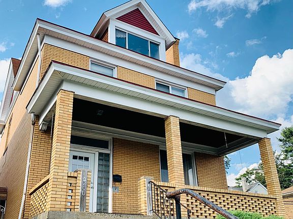 Front view w new cladding, siding and painting