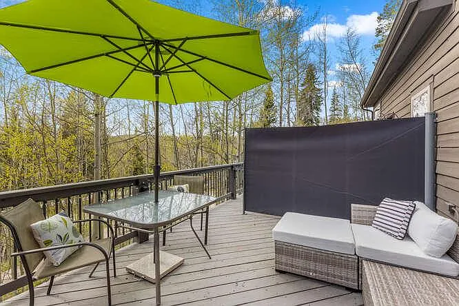 Back deck off of main level, with hot tub and outdoor furniture