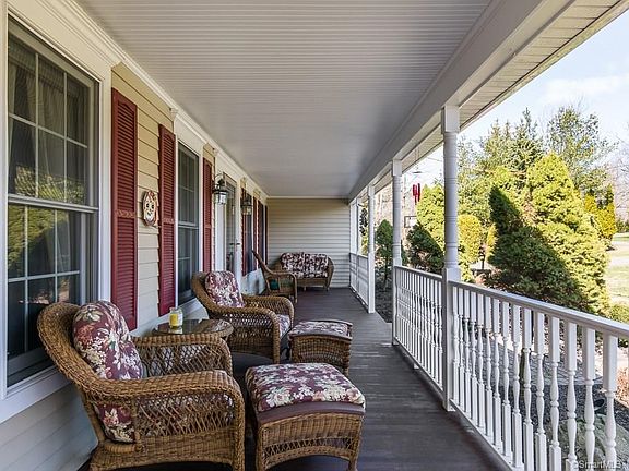 The mahogany wrap-around porch is perfect spot for sitting with your morning coffee or relaxing at the end of the day.
