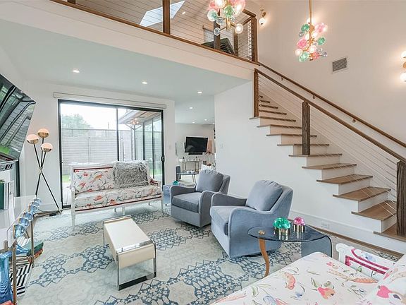Natural light pours into this open and modern living space.