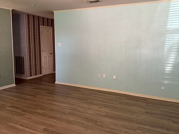 ___ Living Room
"Bright and spacious living area with new wood-look flooring and plenty of natural light. A cozy space to relax, gather, and entertain."