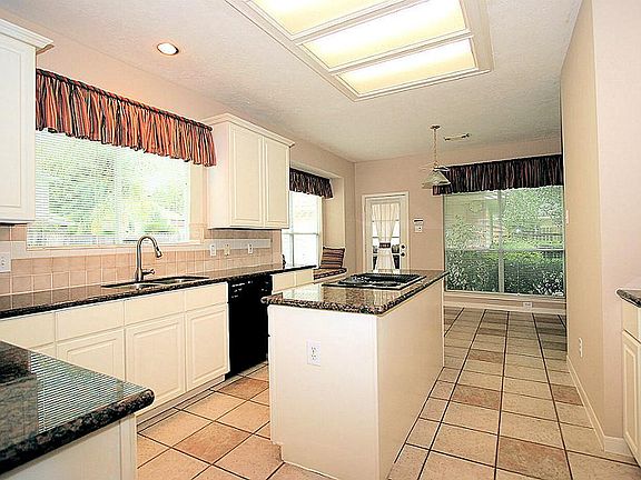 ANOTHER VIEW OF THE KITCHEN.