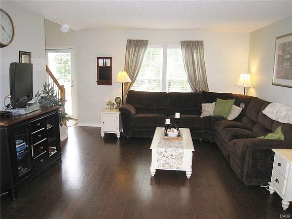 Wider shot of living room looking towards front of the house. Lots of space for families and friends to gather.