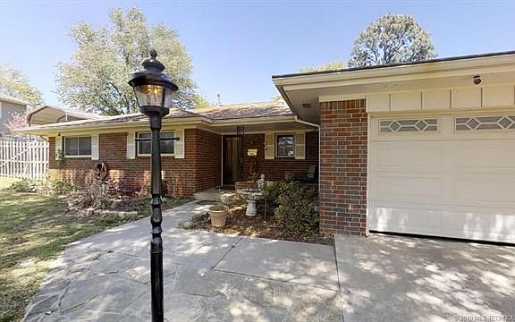 Two car garage, automatic opener and outdoor light post to guide you home