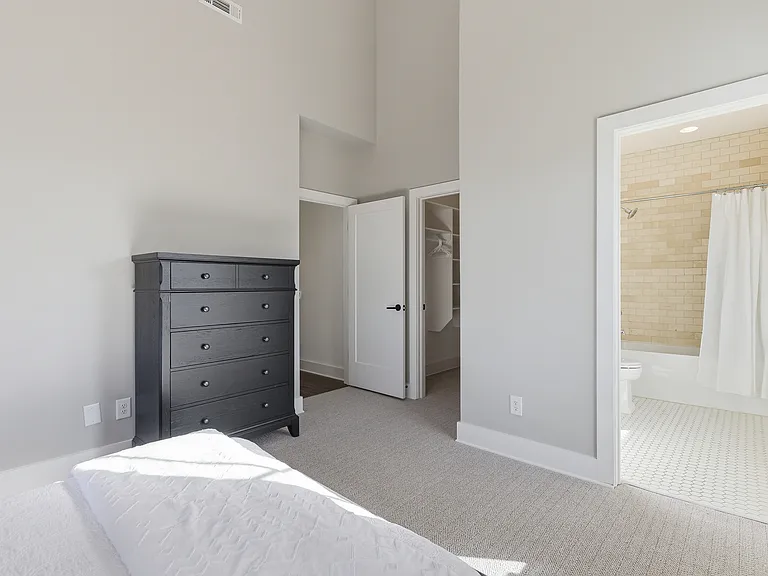 Bedroom 3 with a full over queen bunk bed, ensuite bathroom, and dresser for your belongings. Also includes a walk-in closet. Located on the 3rd floor.