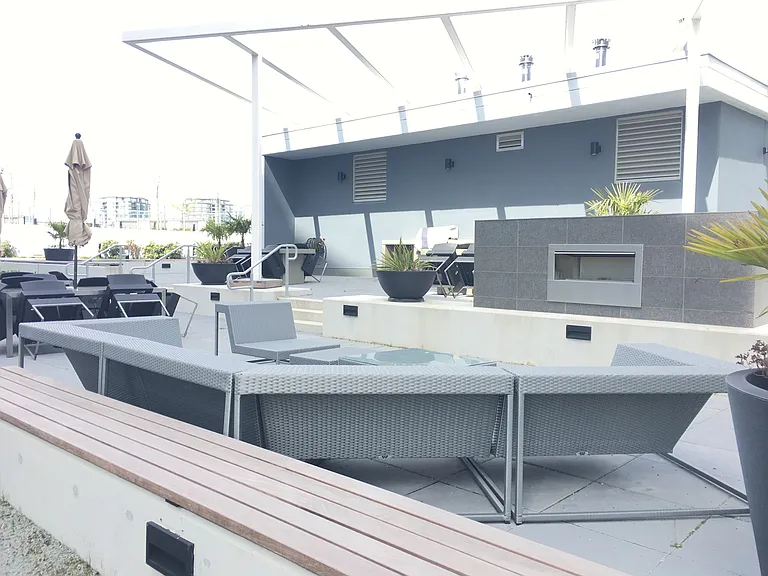 Condo facilities with BBQ and picnic areas.