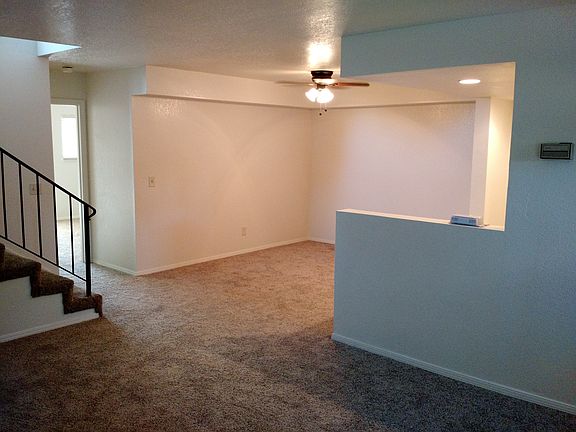 Dining room with ceiling fan.