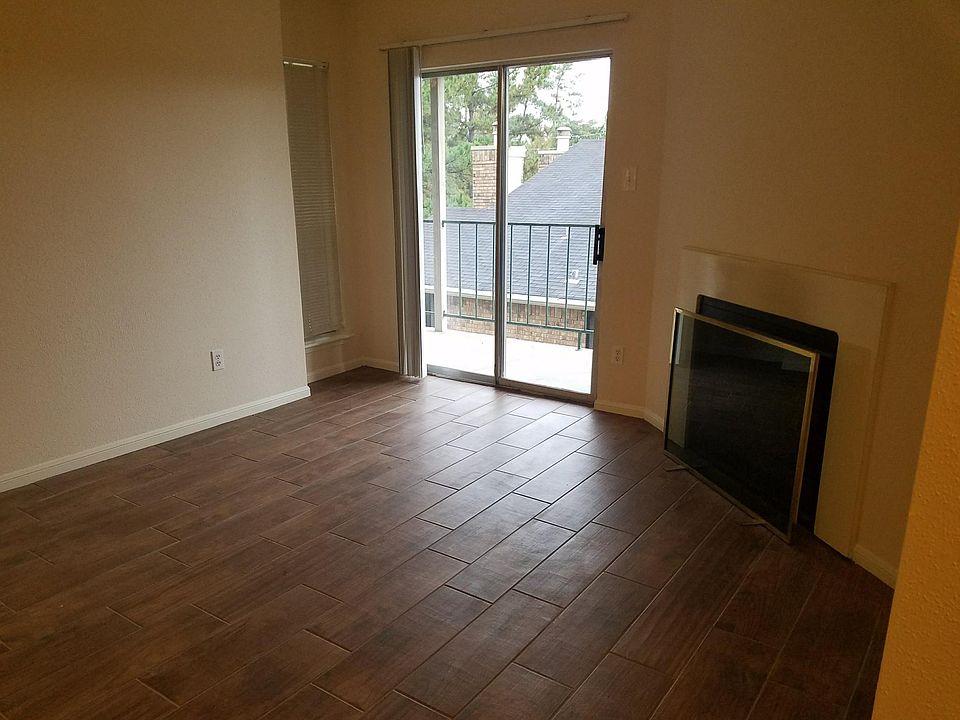 Living room with working fireplace and balcony access