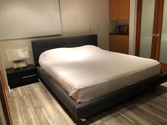 bedroom with pocket door and adjacent bath