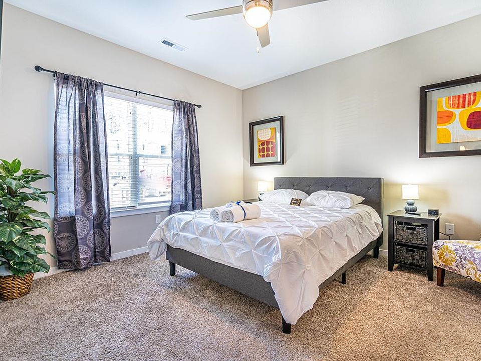 Master Bedroom. The queen-size bed is extremely comfortable with a 12-inch foam mattress and duvet cover. Black-Out curtains help keep the room dark when preferred. Enjoy your own 43-inch TV and personal bathroom. Plenty of dresser and closet space in e