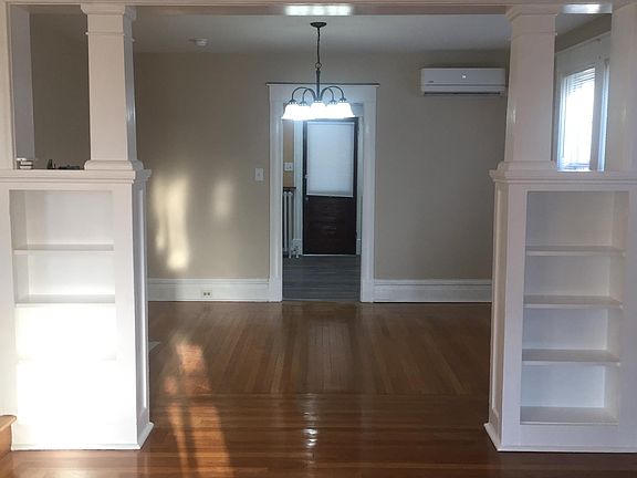 Living room leading into full dining room.