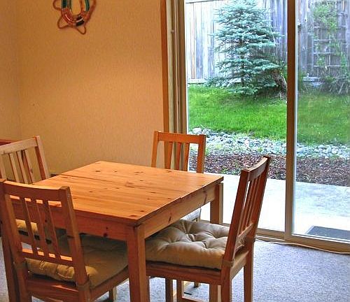 Dining area with glass doors out to private patio