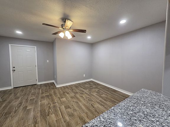 Back entry from parking area and first living/dining area