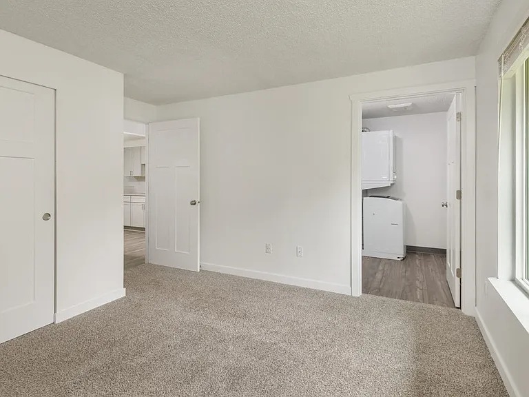 Our Apartment Bedroom with Laundry Room at Wilderness West Apartments in Olympia, Washington