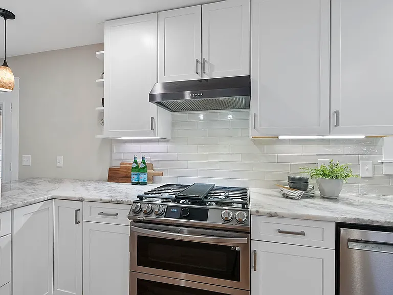 Kitchen with gas range, oven and dishwasher
