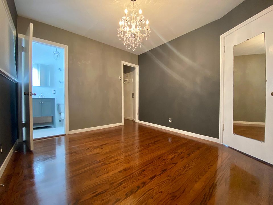 Bedroom with two closets and attached bathroom