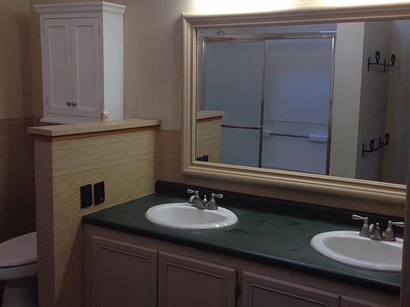 Bathroom with skylight, large shower and double sink