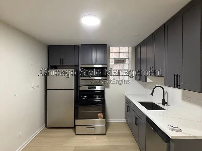 7833 S Colfax Ave — Photo 2