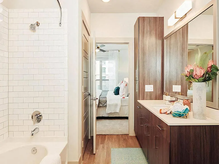 Ensuite Bathroom with Soaking Tub and Contemporary Wood Cabinets