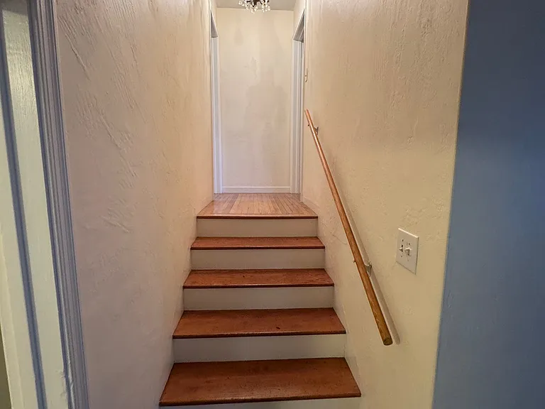 Stairs to bedroom and bathroom