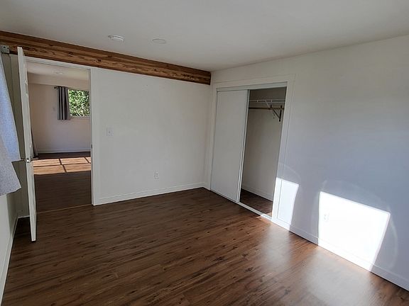 Main bedroom, door opening into living room.